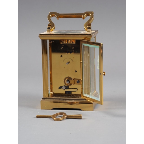 128 - A brass cased carriage clock by J W Benson with white enamel dial and Roman numerals, 5 3/4