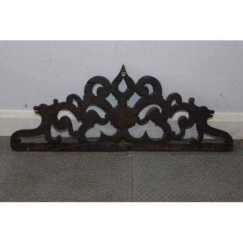 185 - An early 17th century carved oak open scrollwork crest, 37