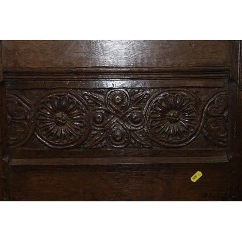 188 - An early 17th century carved oak panelled door, 24