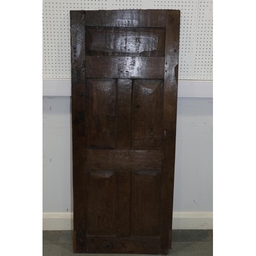 188 - An early 17th century carved oak panelled door, 24