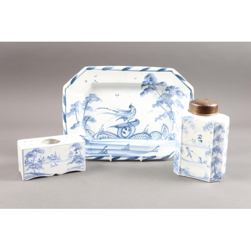 19 - An Oxford delft flower brick, a tea caddy and cover, and an octagonal plate, caddy 6 1/2