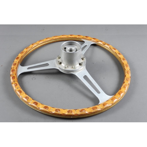 257 - A Derrington type three spoke steering wheel with wood and brass trim, 15