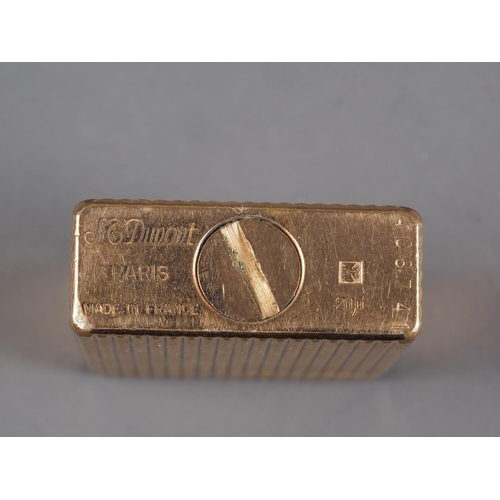 258 - An S T Dupont gold plated textured petrol lighter, serial number AC6741, 1 7/8