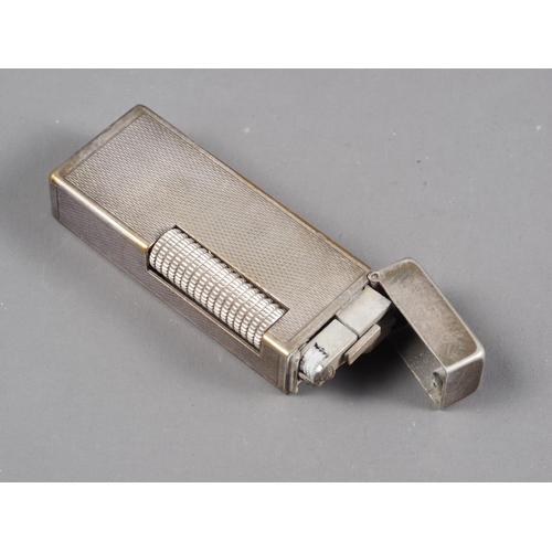 259 - A Dunhill silver plated lighter with engine turned decoration, 2 1/2