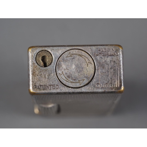 259 - A Dunhill silver plated lighter with engine turned decoration, 2 1/2