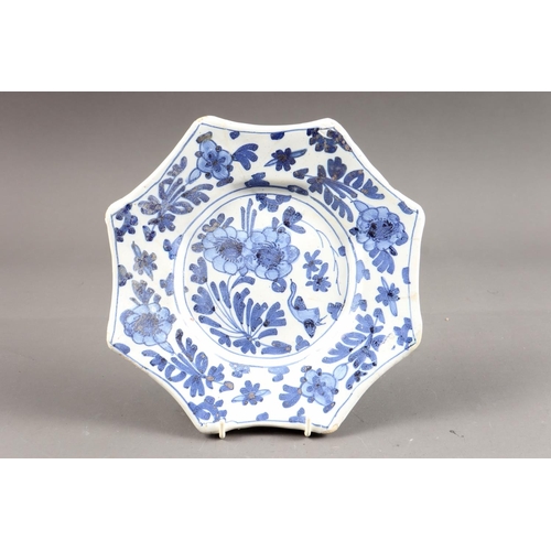 36 - An early 18th century delft octagonal plate with bird and flower decoration, 8