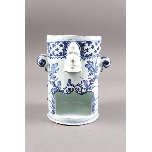 38 - An 18th century English (London) delftware blue and white part food warmer with mask and scroll hand... 