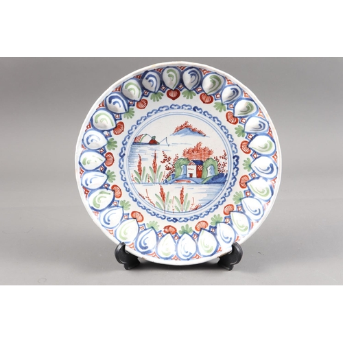 40 - An early 18th century English Bristol? delft lobed dish with polychrome landscape decoration, 10