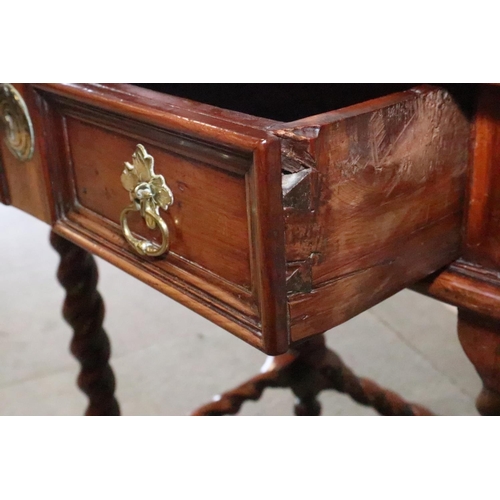 430 - An early 18th century yew side table, fitted one drawer with brass shaped drop handle, on bobbin tur... 