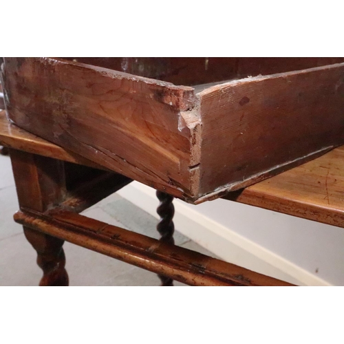 430 - An early 18th century yew side table, fitted one drawer with brass shaped drop handle, on bobbin tur... 