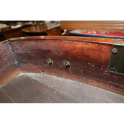 434 - A late Georgian mahogany and rosewood banded serpentine sideboard, fitted centre drawers and deep cu... 