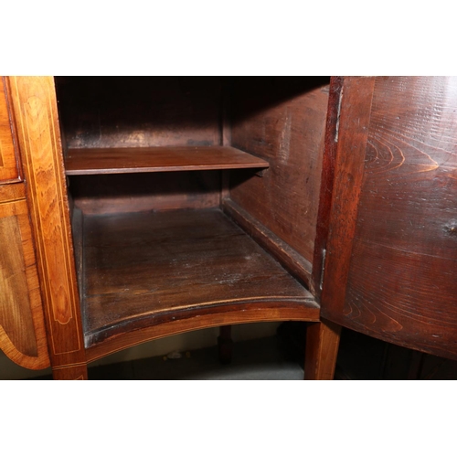 434 - A late Georgian mahogany and rosewood banded serpentine sideboard, fitted centre drawers and deep cu... 