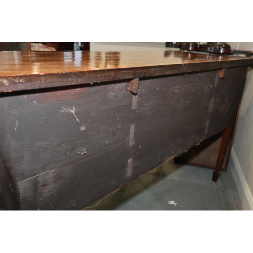 434 - A late Georgian mahogany and rosewood banded serpentine sideboard, fitted centre drawers and deep cu... 