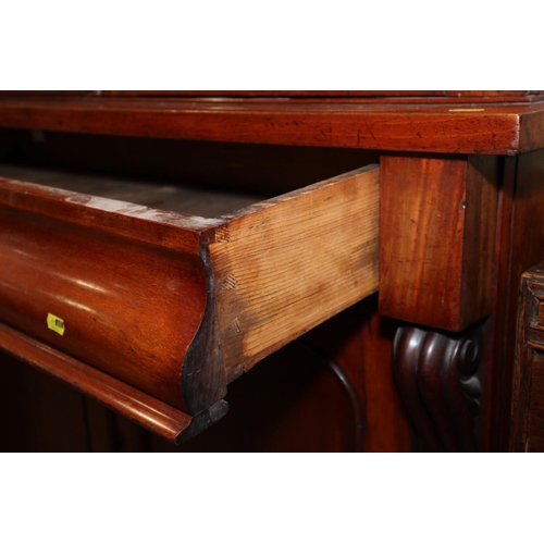 443 - A Victorian mahogany bookcase, the upper section enclosed two glazed doors over drawer and cupboards... 