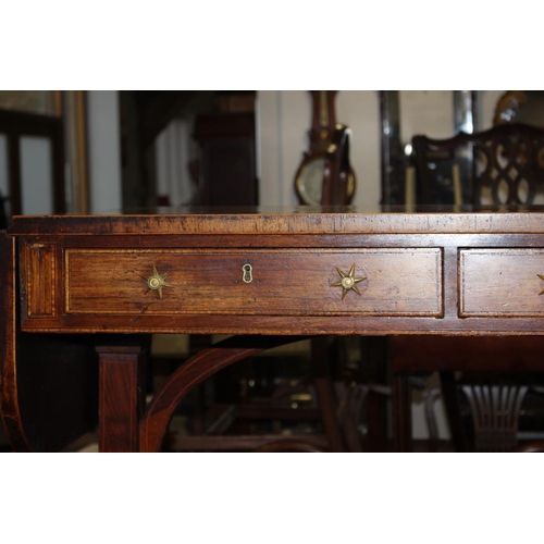 446 - A Regency rosewood and mahogany banded sofa table, fitted two drawers with brass star handles, on sp... 