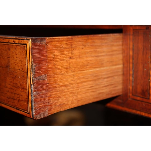 446 - A Regency rosewood and mahogany banded sofa table, fitted two drawers with brass star handles, on sp... 