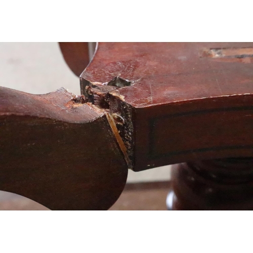 448 - A 19th century walnut and banded low table, on turned column and quadruple splay supports, 24