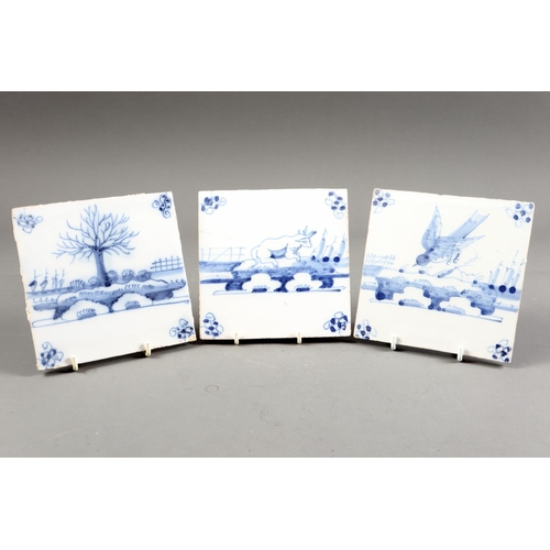 45 - A set of three 18th century Delft tiles with cow, tree and bird (one restored)