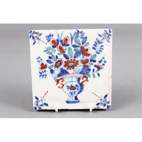 46 - An 18th century London delft polychrome tile with vase of flower decoration (ex Jonathan Horne)