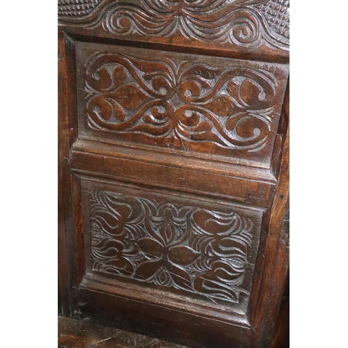 460 - A mid 17th century carved oak wainscot armchair with two-panel back, on turned and stretchered suppo... 