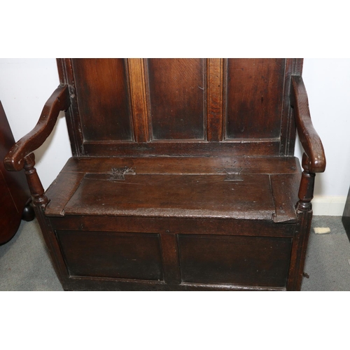 462 - A late 17th century panelled oak box seat settle, on moulded stile supports, 39 1/2