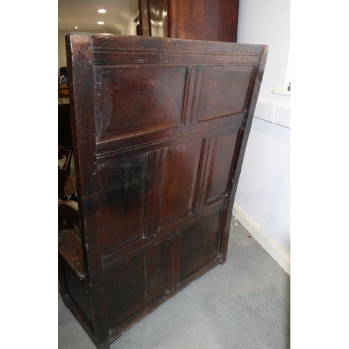 462 - A late 17th century panelled oak box seat settle, on moulded stile supports, 39 1/2