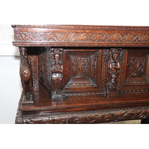 465 - An early 17th century carved oak buffet/court cupboard with griffins, caryatids and herms, frieze ce... 