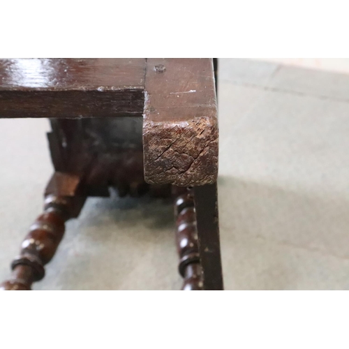 467 - A late 17th century oak joint stool, on turned and stretchered supports, seat underside stamped W P ... 