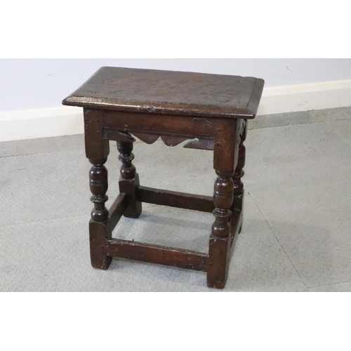 467 - A late 17th century oak joint stool, on turned and stretchered supports, seat underside stamped W P ... 