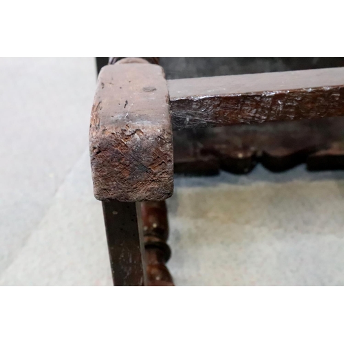 467 - A late 17th century oak joint stool, on turned and stretchered supports, seat underside stamped W P ... 