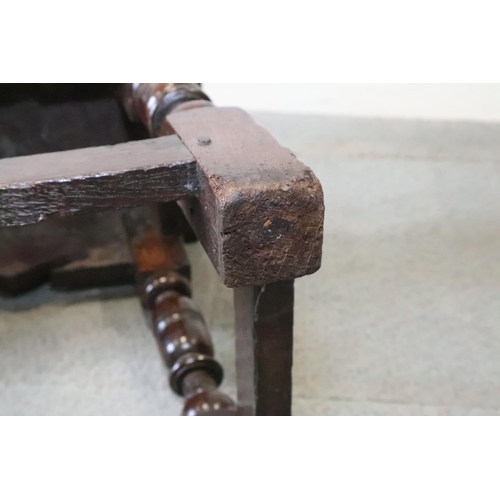 467 - A late 17th century oak joint stool, on turned and stretchered supports, seat underside stamped W P ... 