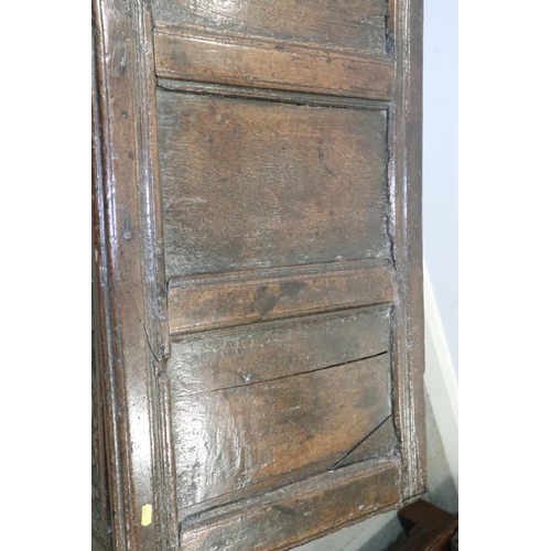 472 - A late 17th century carved oak four panel front coffer, dated 1693, on stile supports, 52