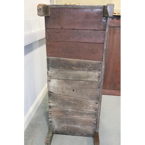 472 - A late 17th century carved oak four panel front coffer, dated 1693, on stile supports, 52