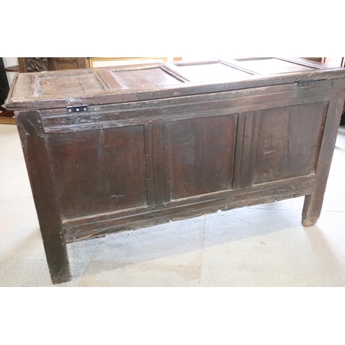 472 - A late 17th century carved oak four panel front coffer, dated 1693, on stile supports, 52