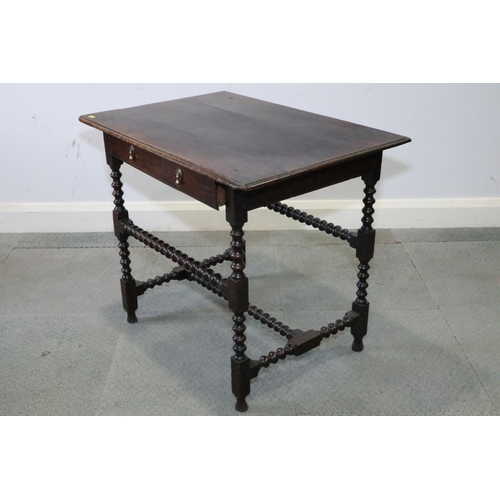 475 - An 18th century oak side table, fitted one drawer with brass drop handles, on bobbin turned and stre... 