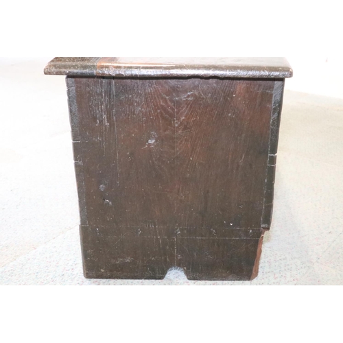 476 - A 17th century oak boarded coffer, on panel end supports, 51