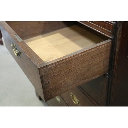 477 - A bachelor's early Georgian oak chest of two short and three long graduated drawers with ring with b... 