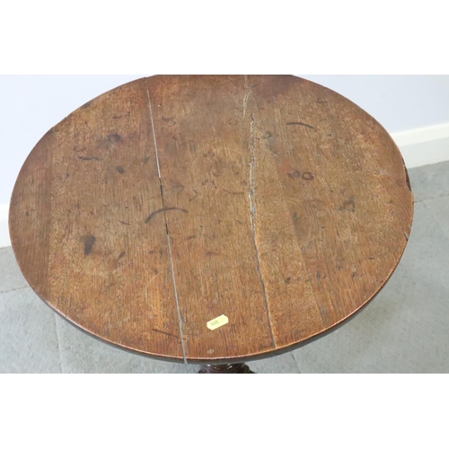 479 - An 18th century oak circular occasional table, on baluster column and tripod splay support, 21 3/4