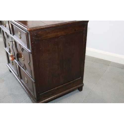 481 - A late 17th century oak chest of three drawers with fielded panel fronts and brass drop handles, 35