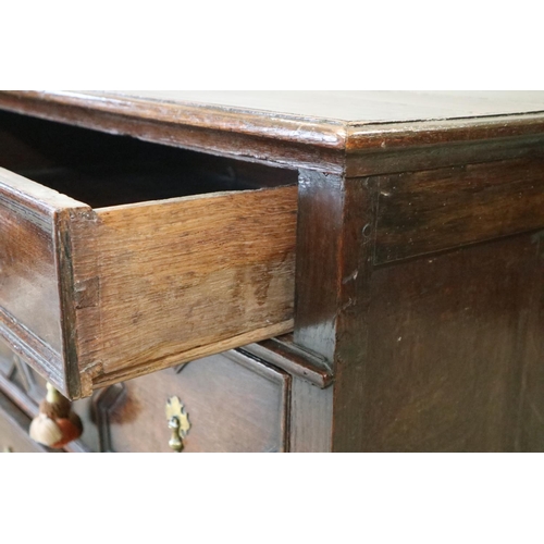 481 - A late 17th century oak chest of three drawers with fielded panel fronts and brass drop handles, 35