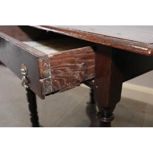 482 - A William and Mary oak side table, fitted one drawer with brass axe-head handles, on turned supports... 