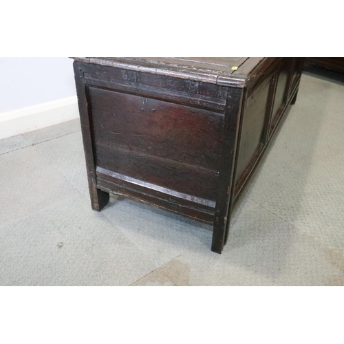 485 - A 17th century oak triple panel front coffer, with five panel top on stile supports, 60