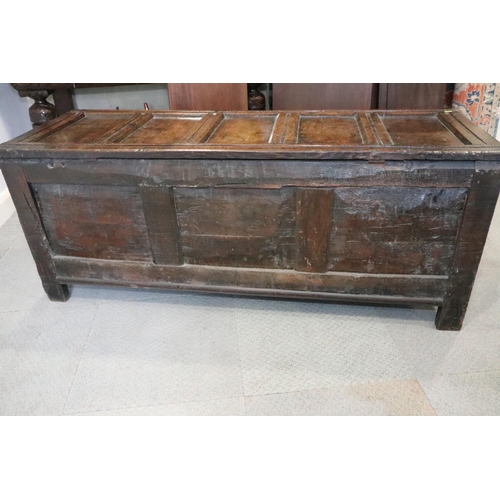 485 - A 17th century oak triple panel front coffer, with five panel top on stile supports, 60