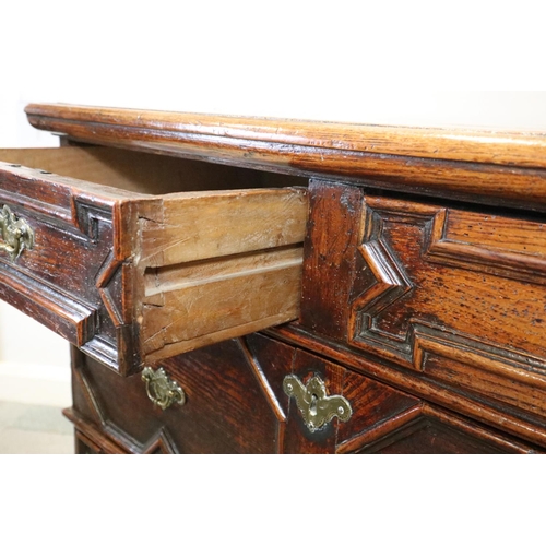 487 - An early 18th century oak chest of two short and three long drawers  (one shallow and two deep) with... 