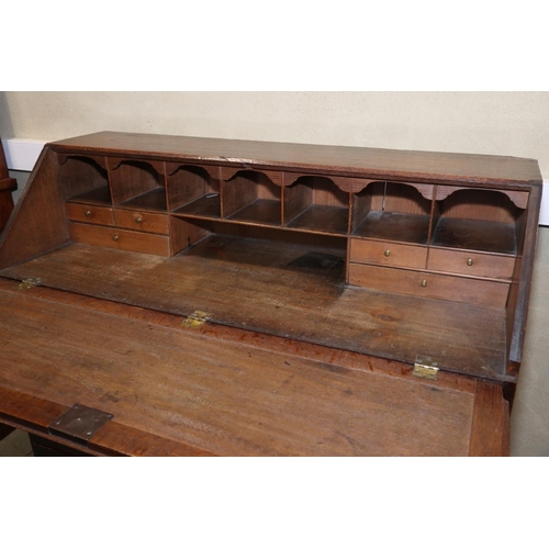 489 - A late 18th century oak fall front bureau with fitted interior over two short and three long graduat... 