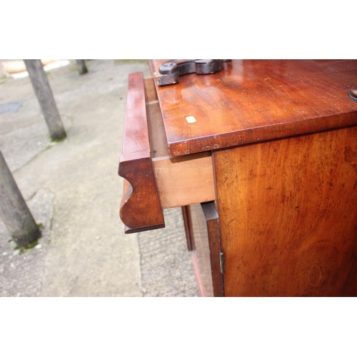 500 - A Victorian mahogany chiffonier with carved ledge back over two drawers and cupboards, on block base... 