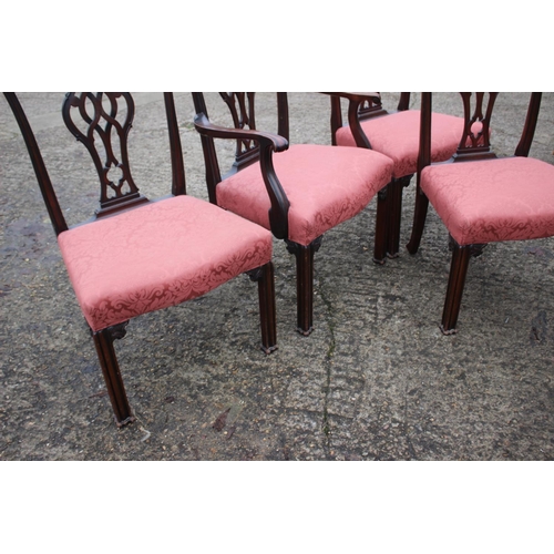 501 - A set of four mahogany Chippendale design carved splat back dining chairs, upholstered in a pink bro... 