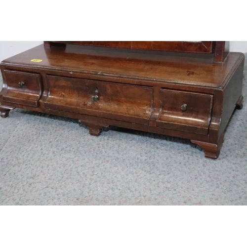 519 - An 18th century walnut toilet mirror, on plateau base, fitted three drawers, on ogee bracket feet, 1... 