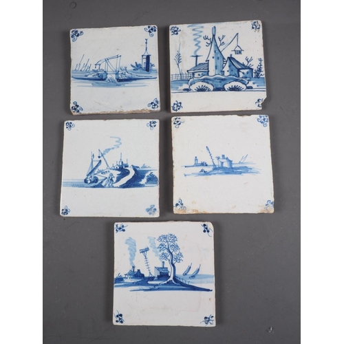 52 - An 18th century English delft blue and white tile with bridge and tower, and four similar tiles with... 