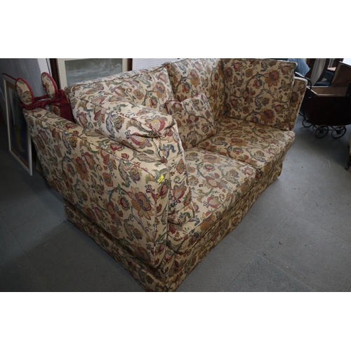 554 - A two-seat Knowle settee, upholstered in a Jacquard weave of 17th century design, frame 68